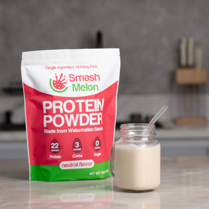 Smash Melon Protein Powder pouch alongside a protein drink in a kitchen setting